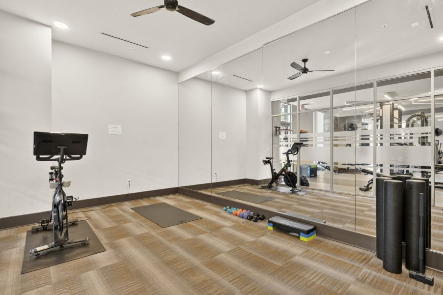 Van Alen apartments resident amenity fitness center with cardio and weight machines